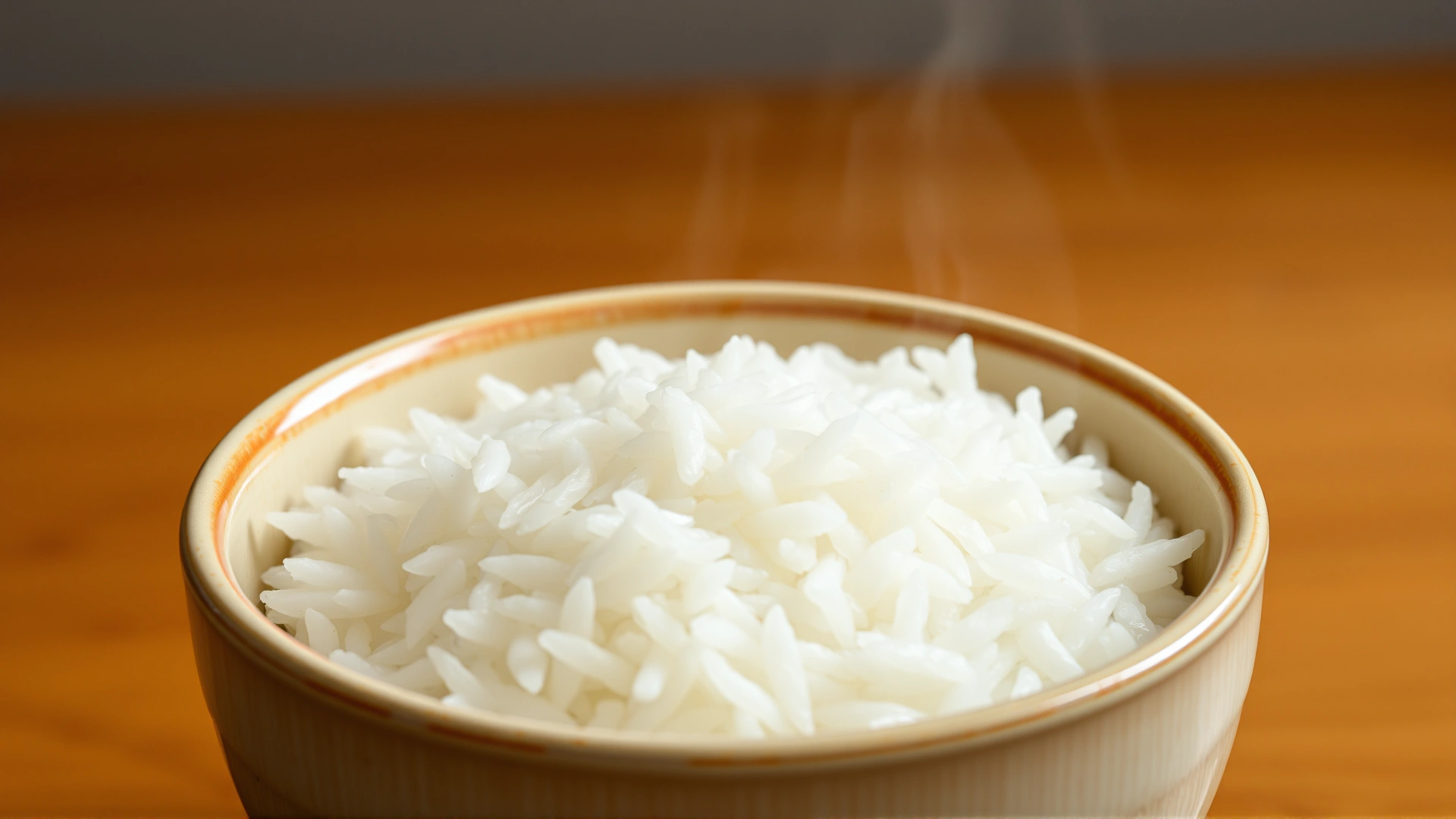 Simple ceramic bowl filled with freshly cooked white rice, steam visible, placed on a wooden countertop, minimalistic style.